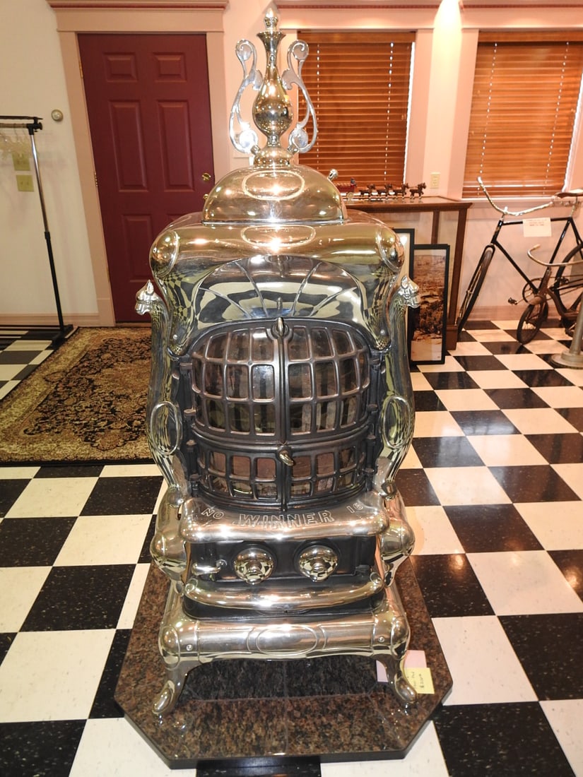 Janney-Semple-Hill Co. The Winner No. 16 Parlor Stove: Ornate antique cast iron and nickel parlor stove marked Janney-Semple-Hill Co., Minneapolis, Minn. The Winner No. 16. Newly chromed/reconstructed per consignor notes, with decorative body, mica-style