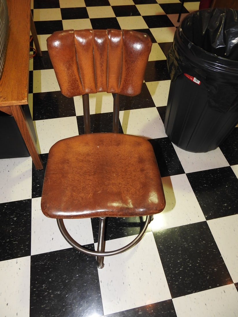 Sturgis Posture Chair with Leather Seat: Sturgis Posture Chair Company operator chair with metal frame, round foot ring, brown leather seat/back pads, and adjustable-style industrial/operator form. Marked Sturgis Posture Chair, Sturgis,