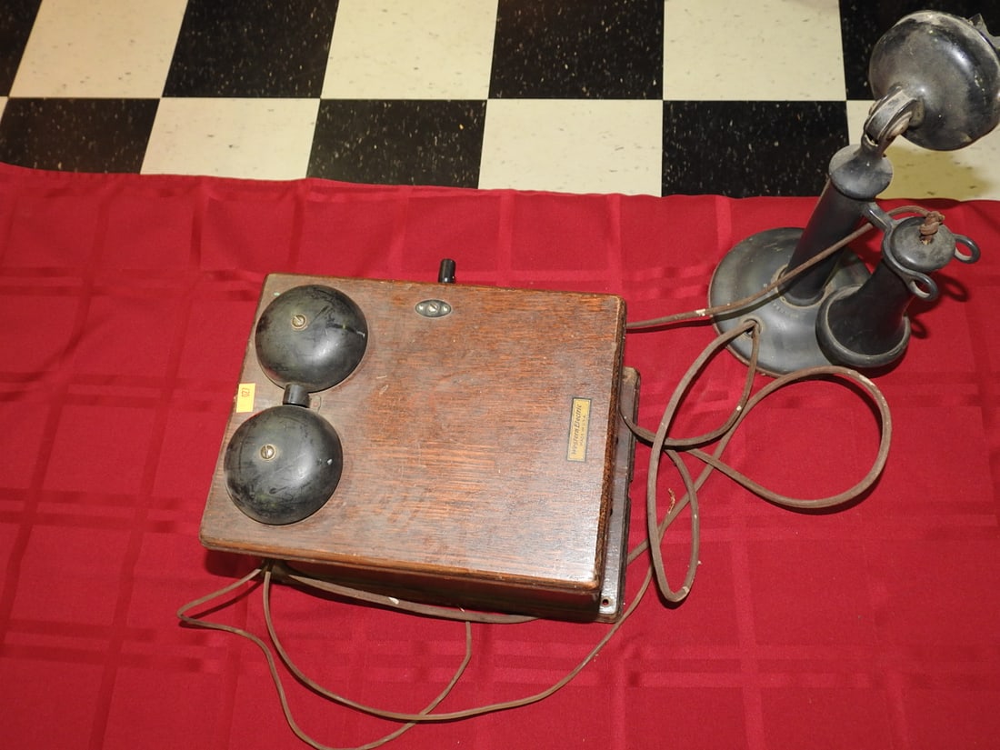 Western Electric Oak Telephone with Bells: Antique Western Electric oak telephone/intercom unit with double bells, receiver, cord, and metal transmitter/horn components. Western Electric Made in U.S.A. label visible. Transmitter/mouthpiece are