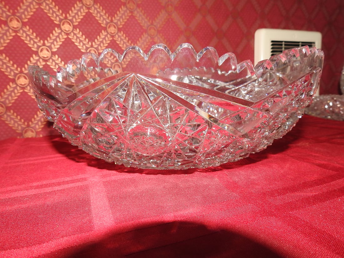 ABP Cut Crystal Round Centerpiece Bowl: American Brilliant Period style hand-cut crystal round centerpiece/serving bowl with hobstar, fan, geometric miter cuts and scalloped sawtooth rim. Approx. 4 x 12 x 12 in. Unmarked unless otherwise