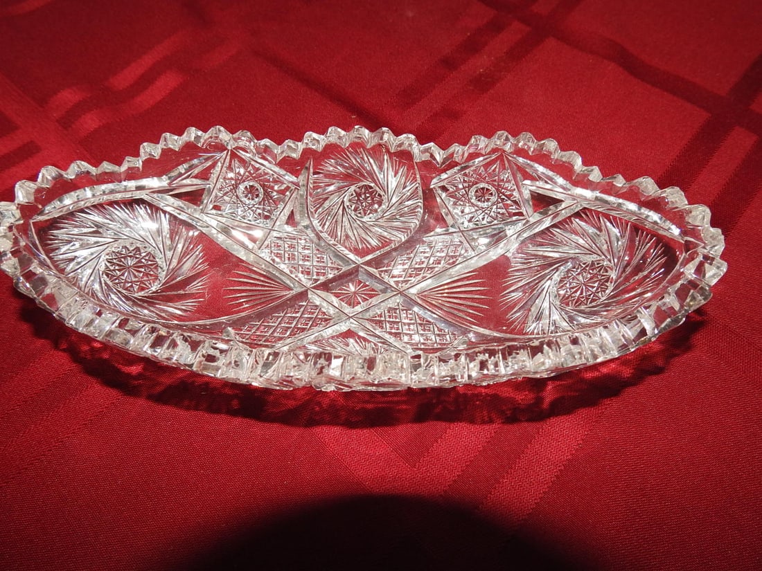 ABP Cut Crystal Oval Relish / Celery Tray: American Brilliant Period style hand-cut crystal oval relish or celery tray with fan, hobstar, crosshatch and sawtooth rim decoration. Approx. 3.5 x 8 x 1.5 in. Unmarked unless otherwise noted;