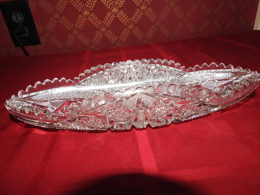 Large ABP Cut Crystal Oval Celery Tray: Large American Brilliant Period style hand-cut crystal oval celery tray with geometric panels, hobstar/fan cutting and sawtooth rim. Approx. 12 x 4 x 2 in. Unmarked unless otherwise noted;
