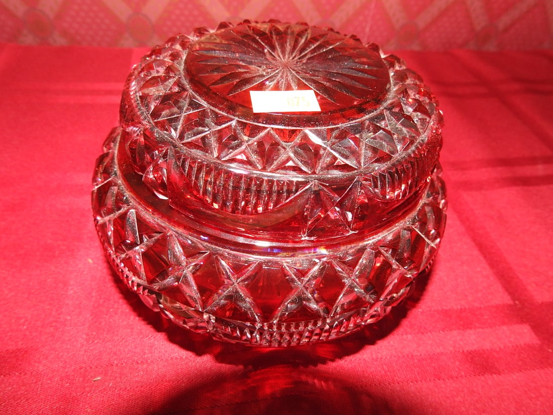 Ruby Red Pressed Glass Covered Candy Dish: Vintage ruby red pressed glass covered candy dish with matching lid and geometric molded pattern. Approx. 3.5 x 5.5 x 5.5 in. Unmarked unless otherwise noted; maker/pattern attribution is based on
