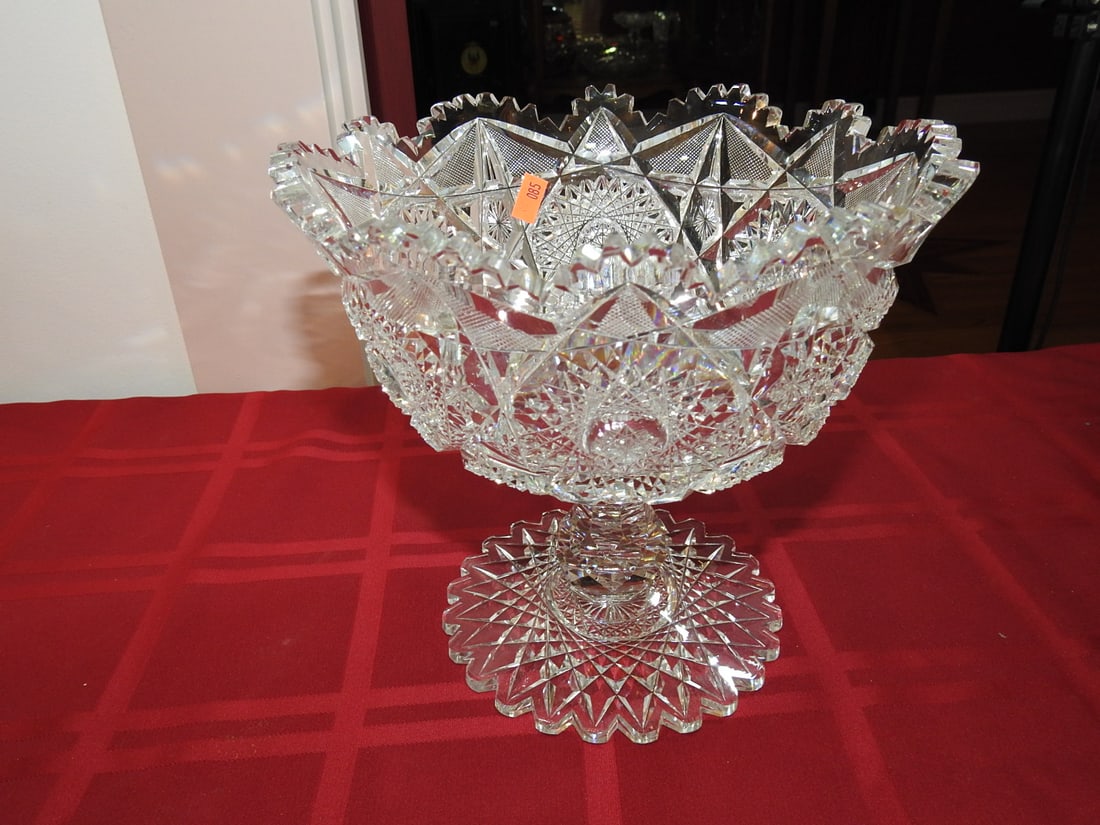 ABP Cut Glass Pedestal Compote with Hobstar Panels: American Brilliant Period hand-cut glass pedestal compote with hobstar panels, fan cutting and scalloped sawtooth rim. Approx. 8 x 9 x 9 in. Unmarked unless otherwise noted; maker/pattern attribution