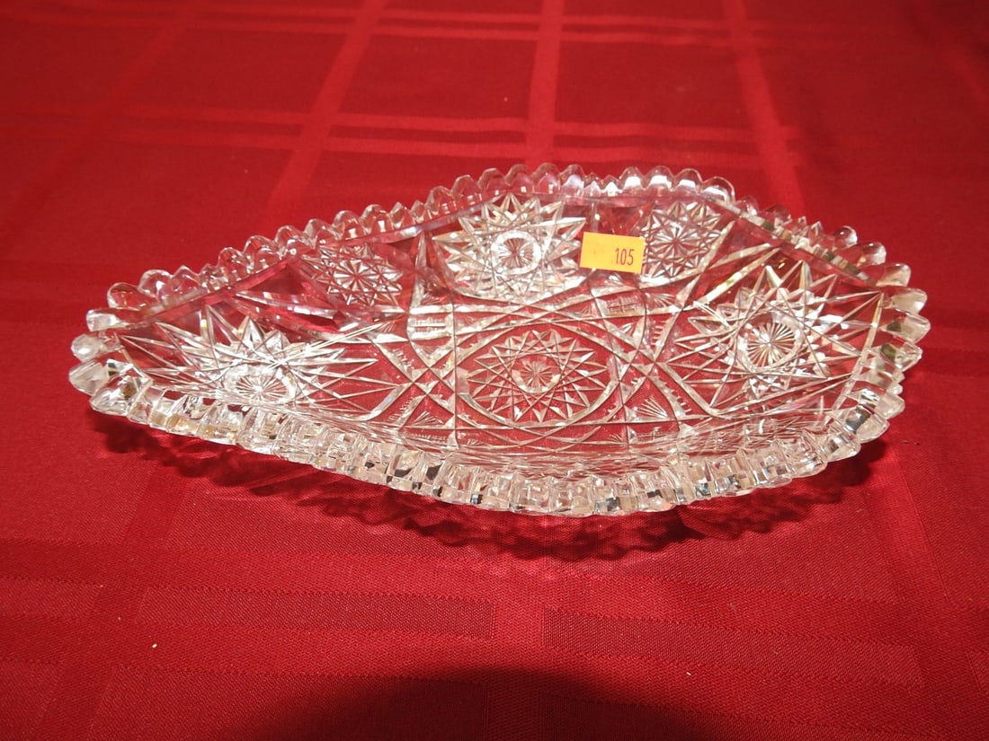 ABP Cut Glass Relish / Celery Tray: American Brilliant Period hand-cut glass relish or celery tray with scalloped rim, hobstar/fan panels and geometric cutting. Approx. 1.25 x 9 x 5 in. Unmarked unless otherwise noted; maker/pattern att
