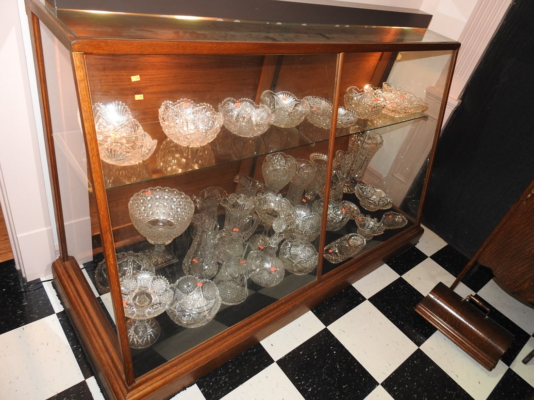 Lighted Glass Display Cabinet, Contents Not Included: Antique lighted display cabinet with glass doors and shelves. Contents shown in photos are not included. Approx. 43 x 69 x 26 in. Shows age-related wear, patina, finish wear, oxidation, surface scratc