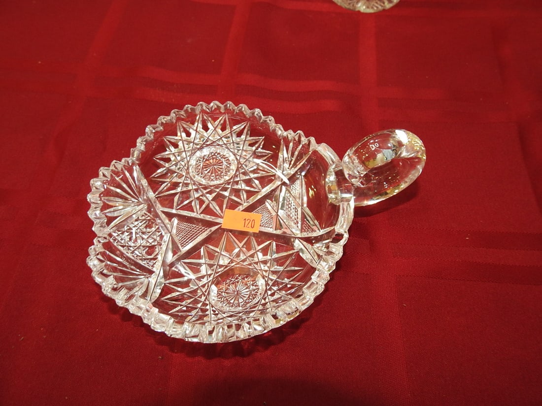 Cut Glass Covered Bonbon / Candy Dish: Cut glass covered bonbon or candy dish with side handle, scalloped rim and geometric cut decoration. Approx. 1 x 6.5 x 5 in. Unmarked unless otherwise noted; maker/pattern attribution is based on