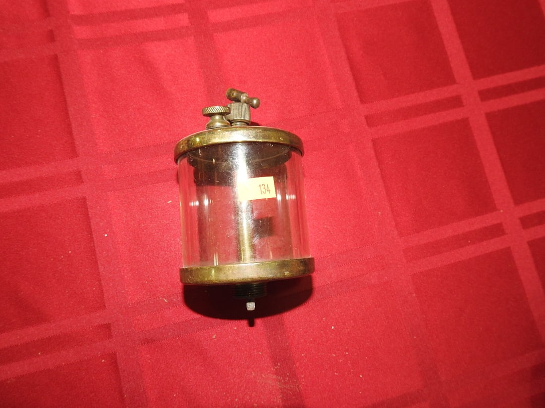 Detroit Brass Co. Brass and Glass Cylinder Oiler: Antique brass and glass cylinder oiler marked Detroit Brass Co. Approx. 5 x 3 x 3 in. Shows age-related wear, patina, finish wear, oxidation, surface scratches and handling wear consistent with age
