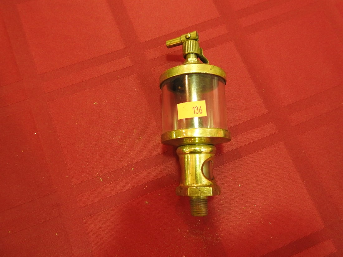 Lavigne Brass and Glass Cylinder Oiler: Antique brass and glass cylinder oiler marked Lavigne. Approx. 6 x 2 x 2 in. Shows age-related wear, patina, finish wear, oxidation, surface scratches and handling wear consistent with age and use;