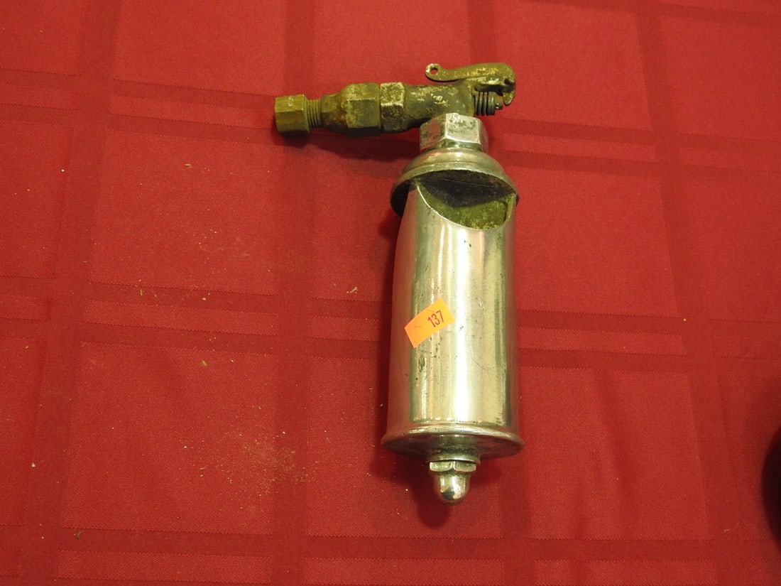 Buell Brass Blowtorch: Vintage brass blowtorch marked Buell, with pump/tank body and nozzle assembly. Approx. 7.5 x 4.5 x 4.5 in. Shows age-related wear, patina, finish wear, oxidation, surface scratches and handling wear