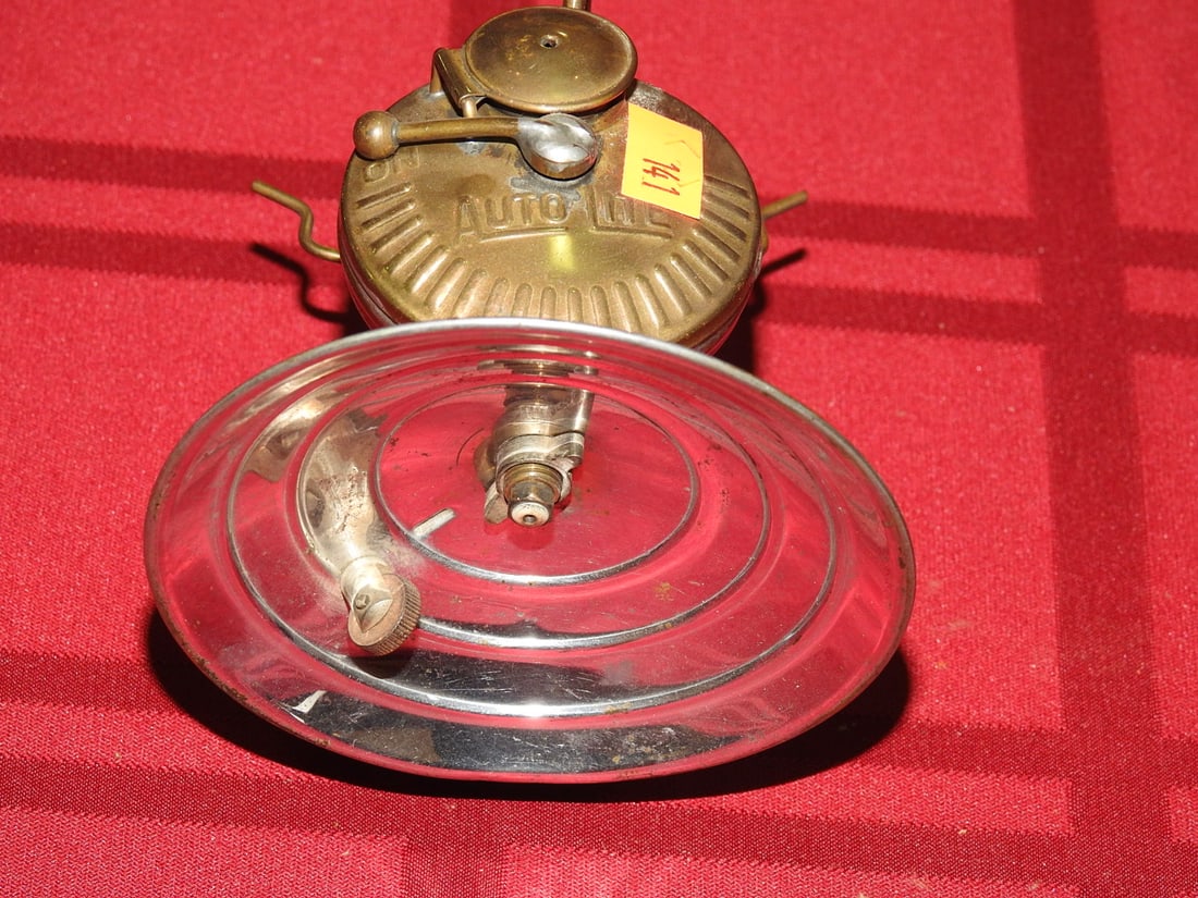 Auto-Lite Universal Carbide Miner Lamp: Vintage Auto-Lite Universal Lamp Co. brass carbide miner lamp. Approx. 4 x 4 x 4 in. No direct lot photos were included in the provided archives. Lighting function not tested. Shows age-related wear, 