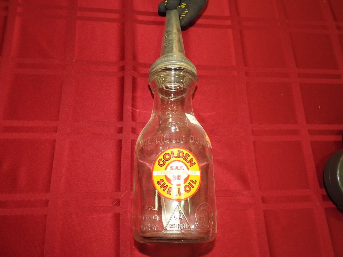 Golden Shell Oil Glass Bottle with Spout: Antique quart glass oil bottle with Golden Shell Oil label and metal spout. Approx. 13.5 x 3.75 x 3.75 in. Empty/decorative collectible; not tested for use. Shows age-related wear, patina, finish