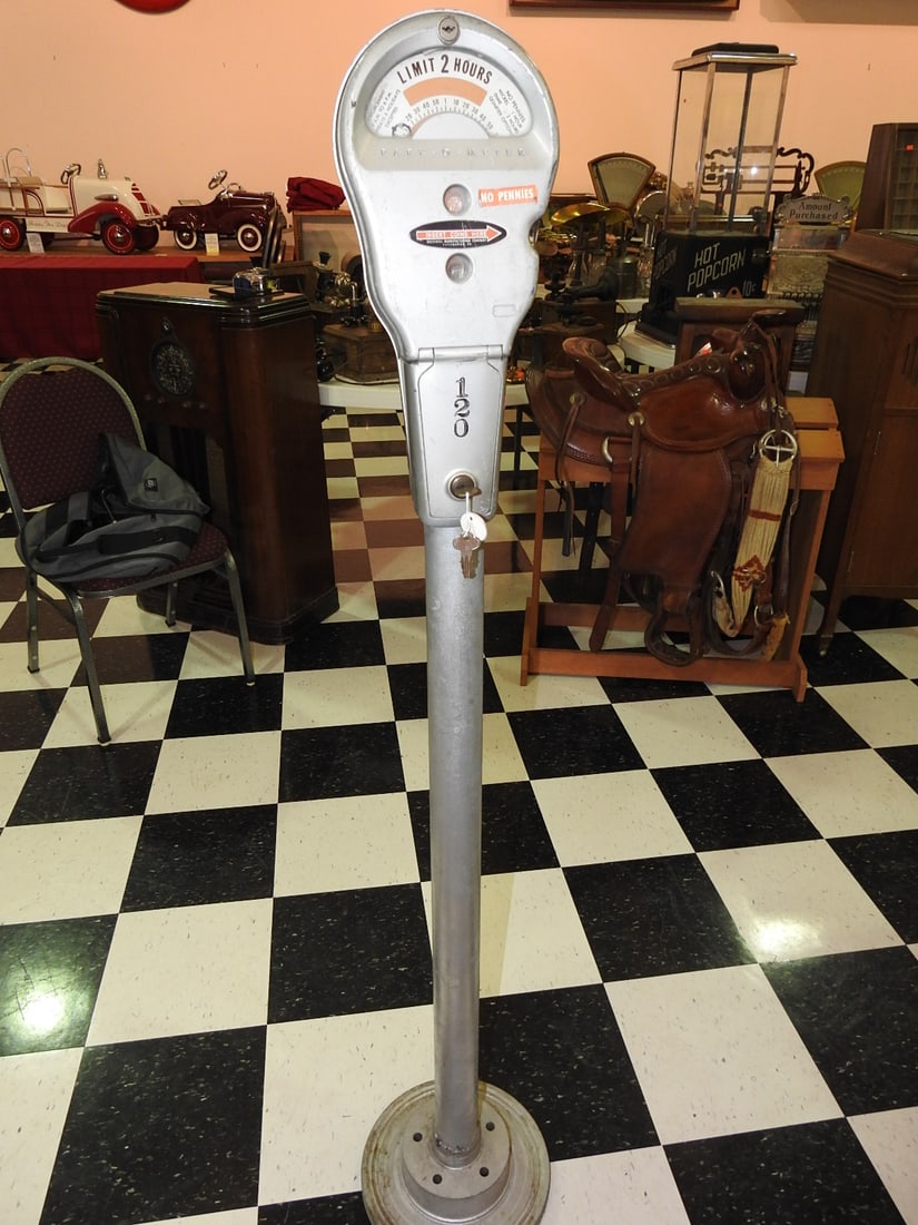 Park-O-Meter 120 Vintage Parking Meter: Vintage Park-O-Meter model 120 parking meter on pole with keys present. Approx. 57.5 x 11 x 11 in. Meter function not tested. Shows paint wear, oxidation, patina, scuffs, surface scratches and