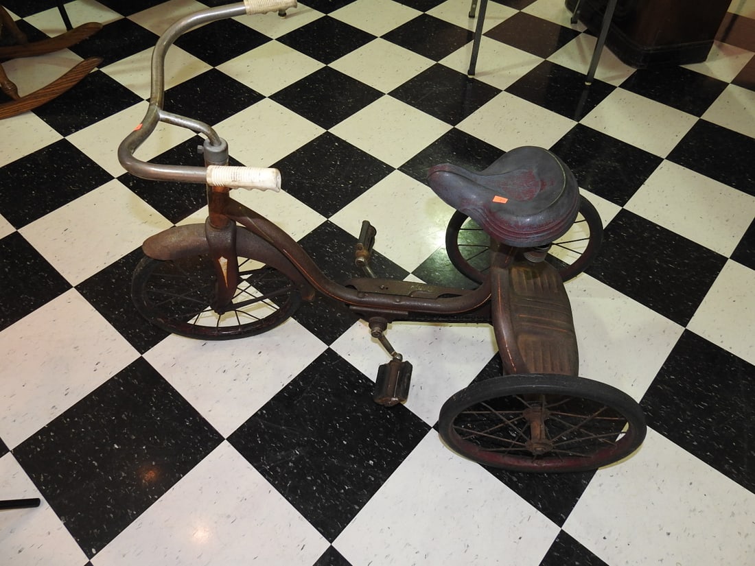 Powell PAL Original Tricycle: Vintage Powell PAL tricycle, noted as 100% original and complete with original red color and strong patina. Approx. 26.5 x 21.5 x 42 in. Shows paint wear, oxidation, surface scratches, tire/wheel