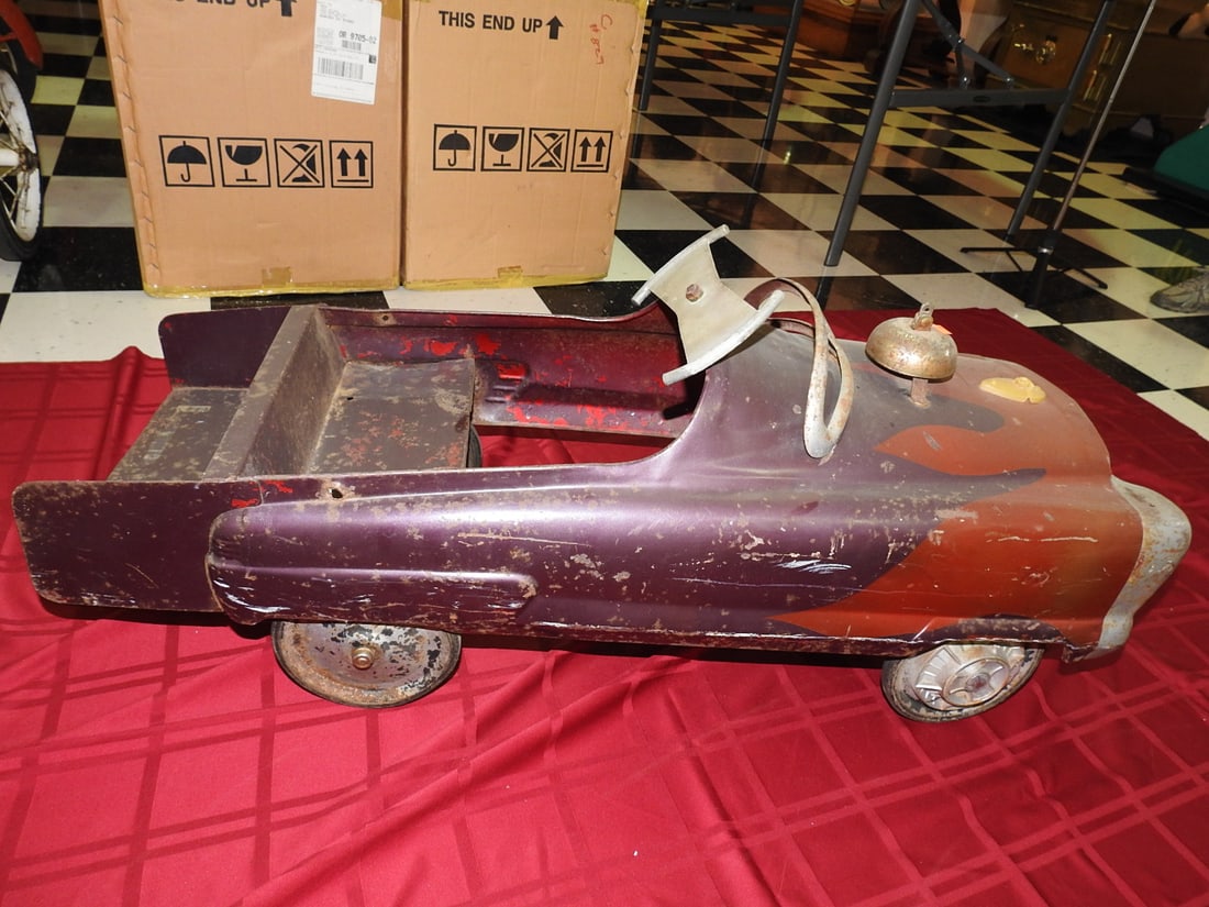 Garton Cadillac Pedal Car: Vintage 1950s Garton Cadillac pedal car with working bell per notes. Approx. 17 x 16 x 32 in. Shows paint wear, scratches, scuffs, oxidation, tire wear and age-related use wear; see photos for