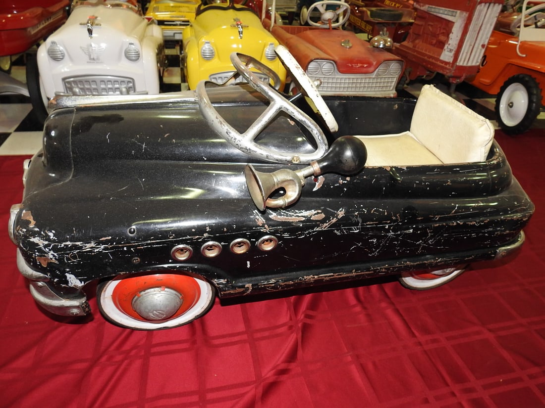 1950s Murray Buick Torpedo Pedal Car: Vintage 1950s Murray Buick Torpedo pedal car with chrome-style detailing and white seat. Approx. 20 x 19 x 40 in. Noted as all original and in fair condition. Shows paint wear, scratches, oxidation,