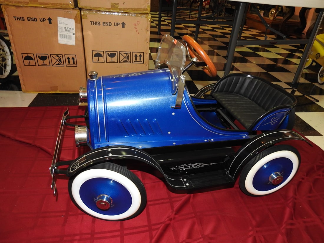 Limited Edition Blue Model T-Style Pedal Car: Limited edition/newer Model T-style pedal car in blue and black with wood-look steering wheel, black seat and whitewall-style wheels. Approx. 23 x 21 x 40 in. Shows light display/handling wear, small 