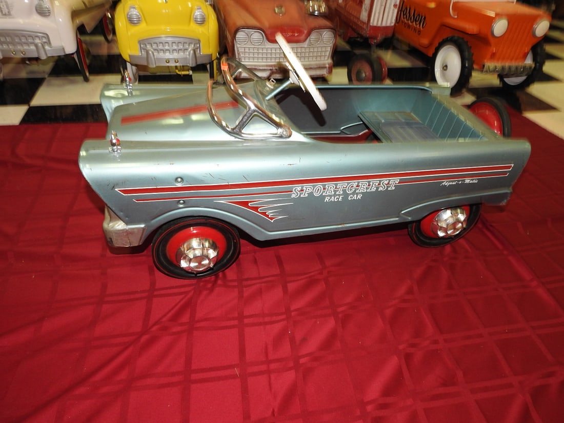 Sportscrest Qualifier Adjust-O-Matic Race Car: Vintage Sportscrest Qualifier Adjust-O-Matic race car/pedal car, noted as original vintage. Approx. 18 x 16 x 37 in. Shows paint wear, scratches, oxidation, surface wear, tire wear and age-related