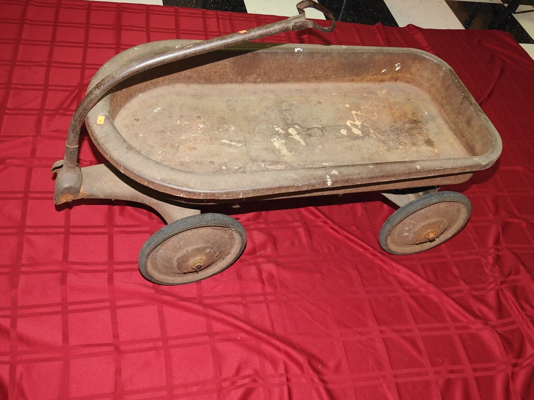 Antique Red Wagon, Unmarked: Antique unmarked wagon, originally red, with metal body, pull handle and aged finish. Approx. 22 x 18 x 38 in. Shows paint loss, oxidation, surface rust, scratches, dents and age-related use wear.