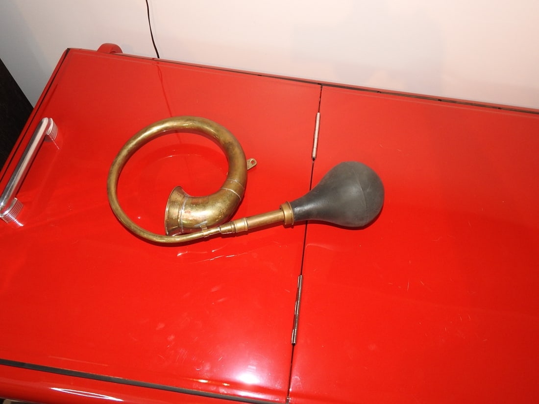 Vintage Brass Bugle / Horn with Rubber Bulb: Vintage brass bugle or squeeze horn with rubber bulb; notes mention the number 14 on the black bulb. Approx. 9 x 14 x 4.5 in. Untested. Shows age wear, patina, dents, oxidation and rubber wear; see