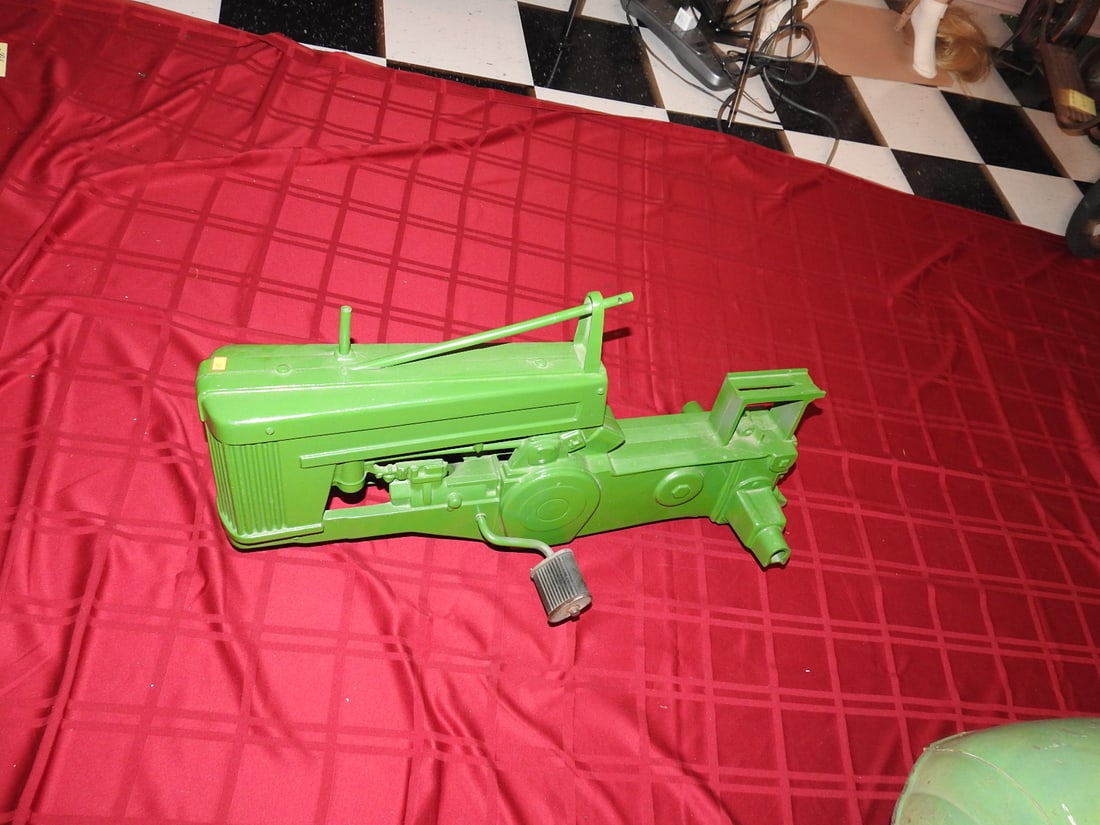 John Deere M60 Small Pedal Tractor Frame: John Deere M60 small pedal tractor frame/body with partial components as shown. Approx. 15 x 14 x 31 in. Frame/project piece. Shows age/use wear, paint loss, scratches, oxidation and missing/partial