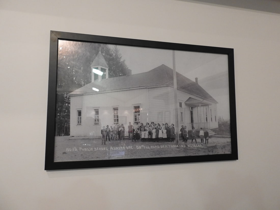 Framed Road of a Thousand Wonders Public School, Aurora OR Photo: Framed black-and-white historical photograph/print, No. 12 Public School, Aurora, Oregon, from The Road of a Thousand Wonders series. Approx. 24 x 27 x 1 in. Frame and print show age/display wear, sur