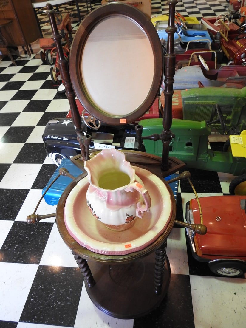 Victorian Wash Stand with Pottery Bowl and Pitcher: Victorian-era wash stand with pottery bowl and pitcher, noted as pottery by Arntes; slight damage on the back as photographed. Approx. 53 x 25 x 22 in. Shows age/use wear, finish wear, scratches,