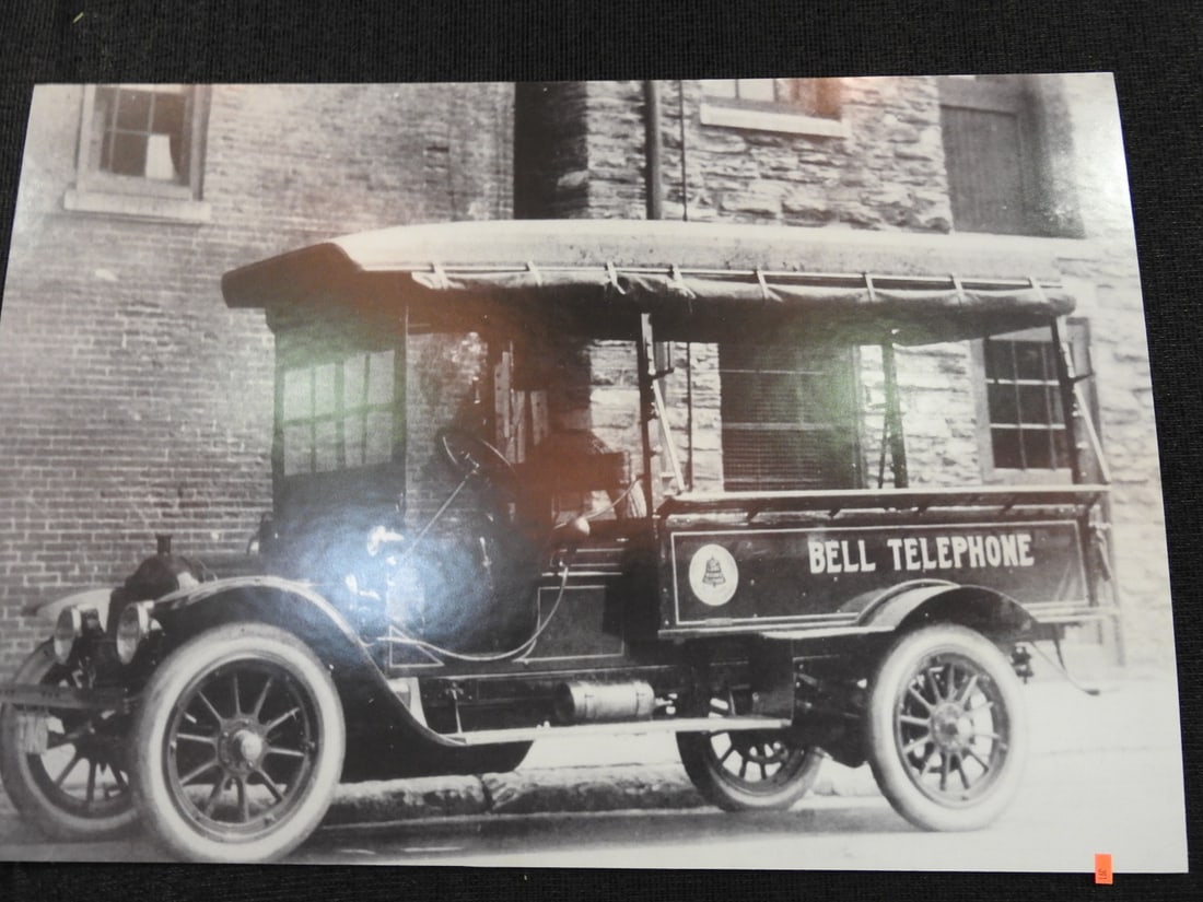 Framed Bell Telephone Truck Photograph / Print: Framed Bell Telephone truck photograph/print with utility vehicle subject matter. Approx. 24 x 35 x 1 in. Frame and print show age/display wear, surface marks, dust and backing wear; see photos for