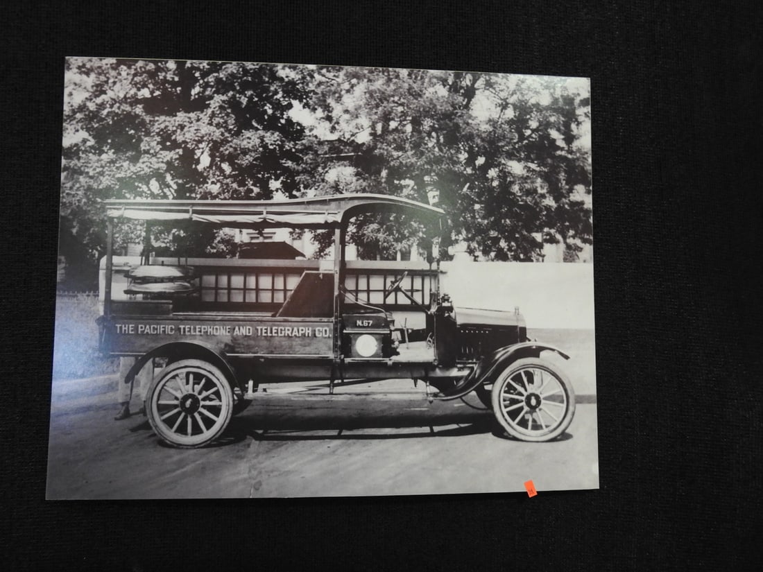 Framed Pacific Telephone & Telegraph Co. Photograph / Print: Framed Pacific Telephone & Telegraph Co. photograph/print with telephone company subject matter. Approx. 22.5 x 28 x 1 in. Frame and print show age/display wear, surface marks, dust and backing wear; 