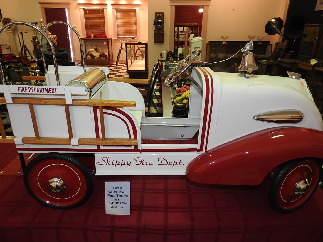 Restored 1936 Gendron Chemical Fire Truck Pedal Car: Restored 1936 Chemical Fire Truck pedal car by Gendron Pioneer Line with Skippy Peanut Butter advertising, ladder/chemical truck styling and red finish. Approx. 27 x 18 x 33 in. Consignor notes