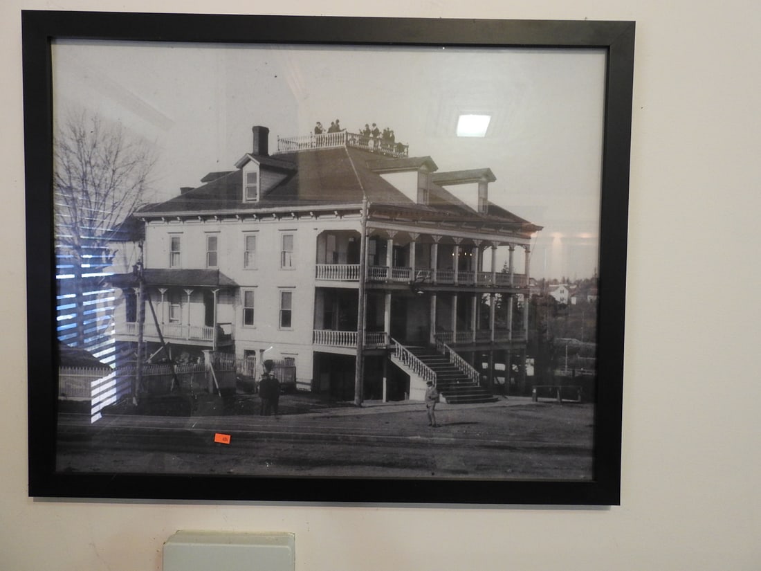 Framed Historic Community Building Photograph: Framed historic community building photograph/print with early building subject matter. Approx. 25 x 31 x 1 in. Frame and print show age/display wear, surface marks, dust and backing wear; see photos
