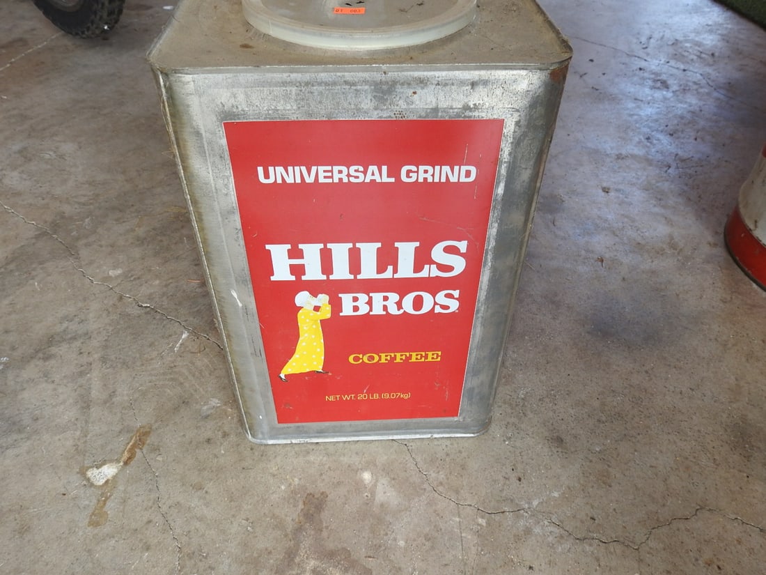 Vintage Hills Bros Universal Grind Coffee Tin: Vintage square Hills Bros Universal Grind coffee tin/canister with red label graphics and original vacuum-pack style lid. Shows surface wear, scratches, oxidation, staining, and age-related storage