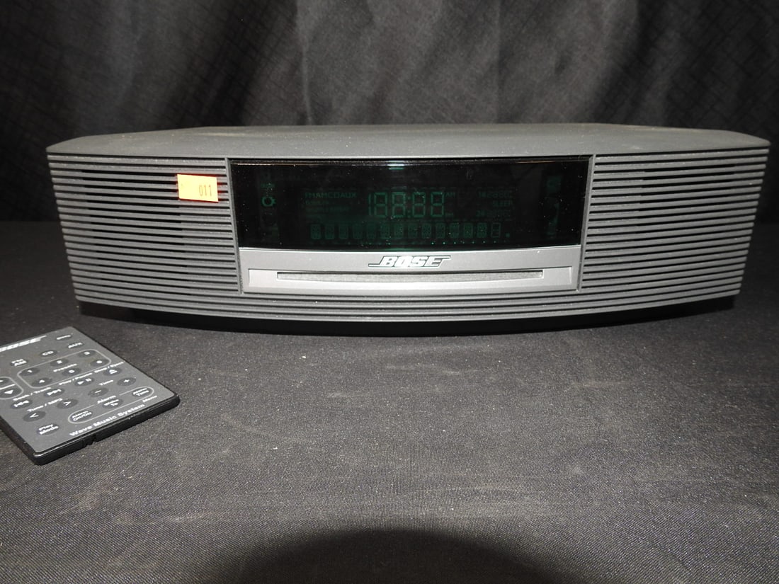 Bose Wave Music System with Remote: Bose Wave Music System with remote. No power cord included. Tested and working. Approx. 5 H x 14.5 W x 9 D in.