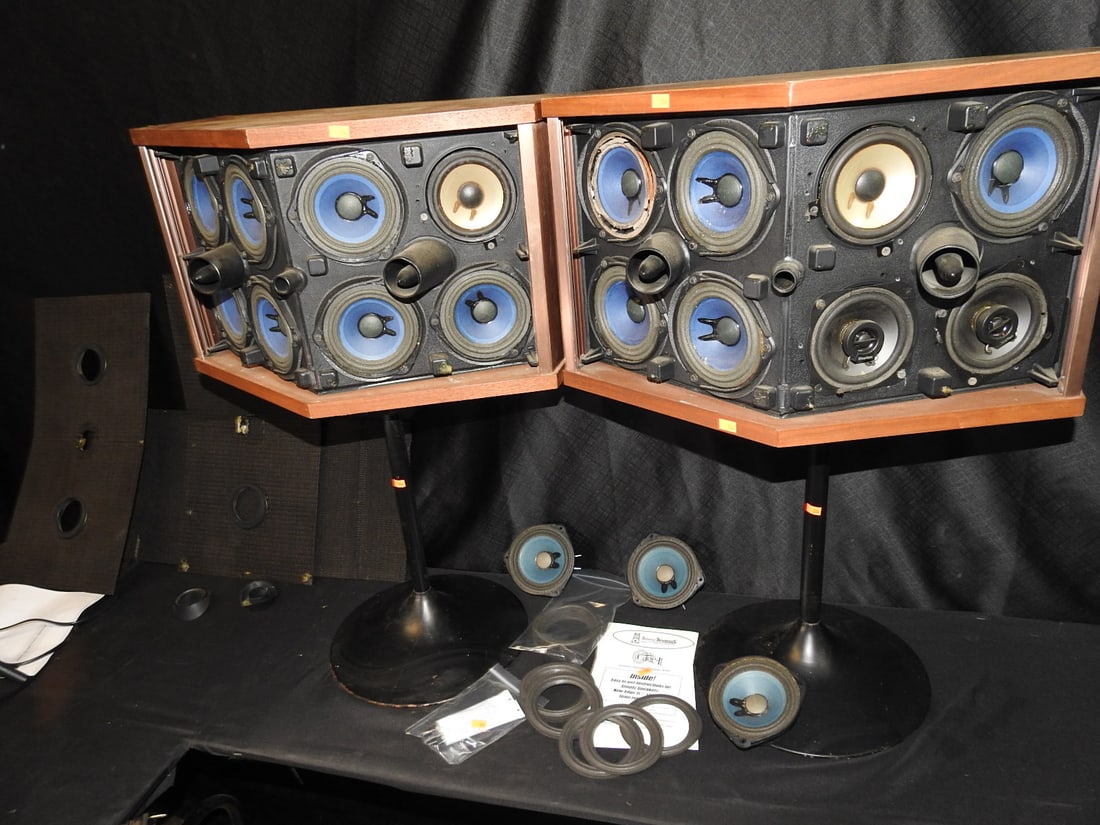 Bose 901 Series V Speakers with Tulip Stands: Bose 901 Series V speaker pair with tulip stands, original covers, and three additional Bose speakers. Several drivers need to be refoamed. Tested functional. Approx. 30 H x 22 W x 13 D in.