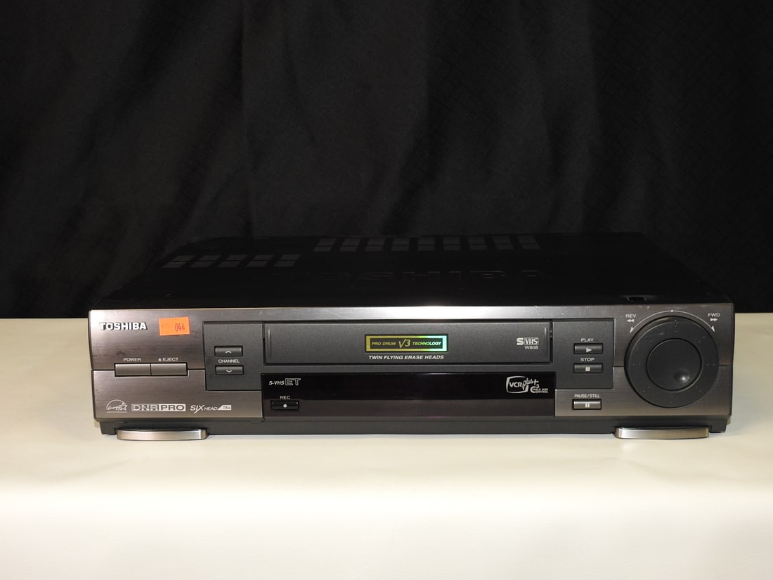 Toshiba W-808 VHS Player: Toshiba W-808 VHS player. Powers on; video output not tested. Approx. 4 H x 17 W x 12 D in.