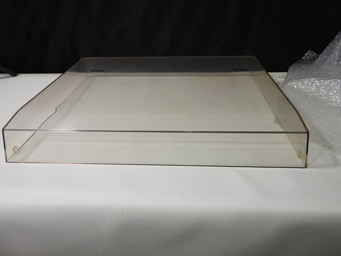 Replacement Turntable Dust Cover: Clear replacement turntable dust cover, manufacturer unknown. Used cover only as shown. Approx. 2.5 H x 17 W x 13.5 D in.