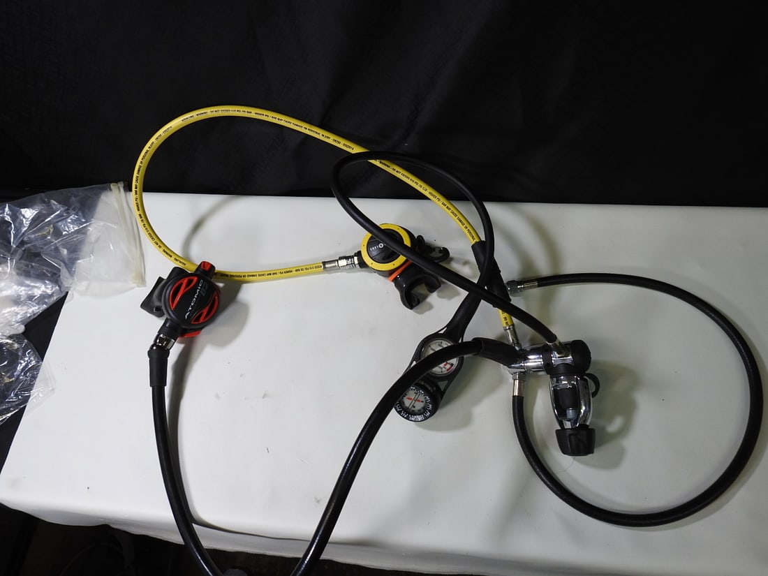 Atomic Aquatics and AquaLung Dual Regulator Lot: Dual mouthpiece/regulator lot including Atomic Aquatics B2/PL780 components and AquaLung ABS component as shown. Measured as packed. Approx. 4 H x 14 W x 9 D in.