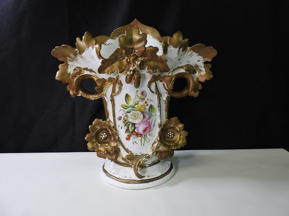 19th Century French Old Paris Porcelain Spill Vase: 19th-century French Old Paris porcelain spill vase with floral decoration and figural handles. Possible AR initials on underside; maker unknown. Approx. 15.5 H x 15 W x 7 D in.