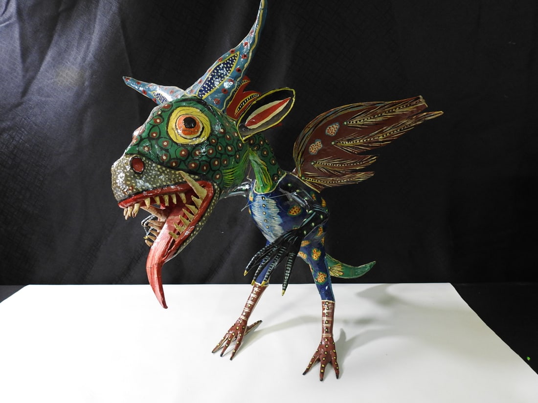 Pedro Linares Style Dragon Alebrije Papier-Mache Figure: Colorful dragon alebrije papier-mache figure attributed in notes to Pedro Linares style/work. Approx. 19 H x 21 W x 28 D in.