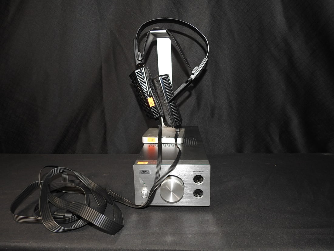 Stax Electrostatic Headphone System with SR-L500 Headphones: Includes Stax electrostatic driver/amplifier, matching SR-L500 electrostatic headphones, headphone stand, and cable as shown. Tested and working. Approx. 8.5 H x 8 W x 13 D in.