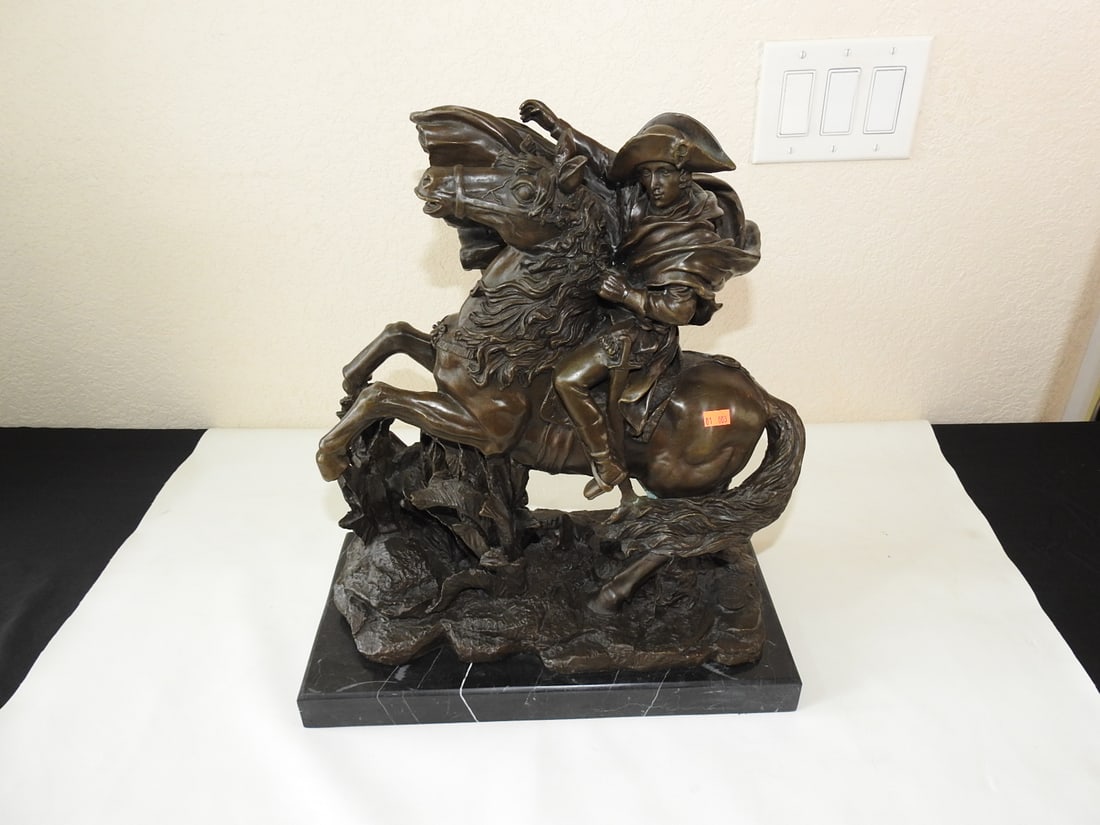 Bronze Napoleon Crossing the Alps Statue after Jacques-Louis David: Bronze statue after Jacques-Louis David's Napoleon Crossing the Alps composition. Marked/noted European Finery and mounted on a black marble base. Approx. 18.5 x 16.5 x 8.25 in.