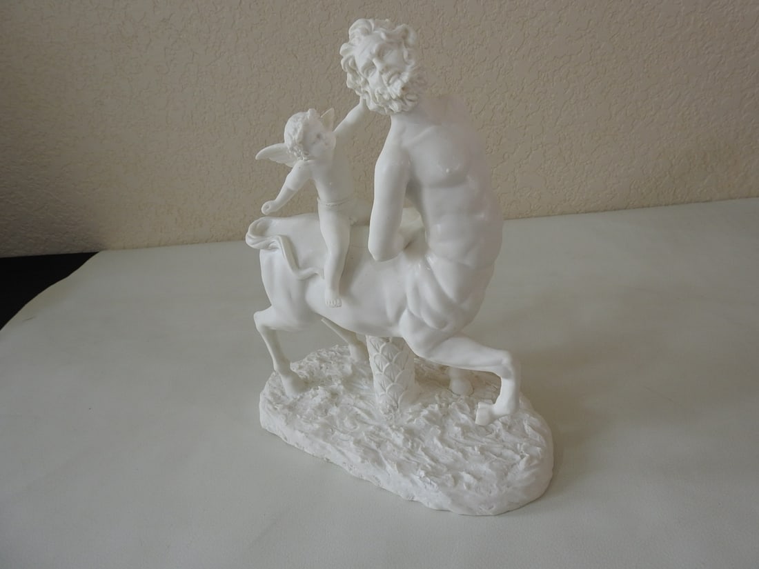Classical Old Centaur Teased by Eros Statue: Top Land Trading Myths and Legends line classical statue depicting Old Centaur Teased by Eros. Approx. 11 x 9 x 5 in.