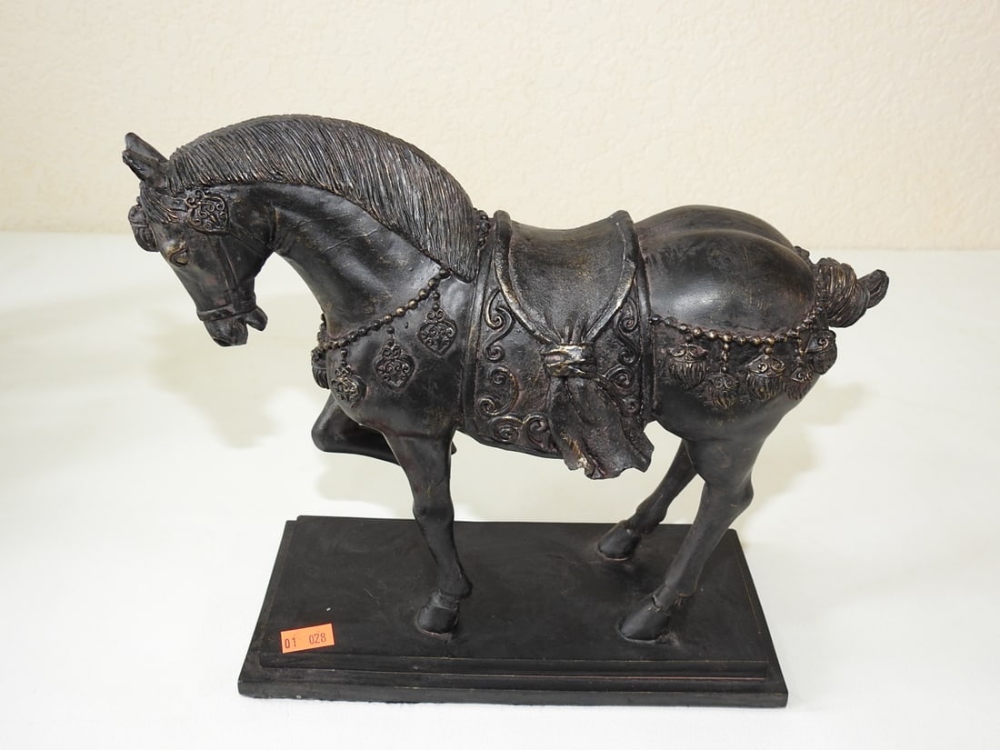 Tang Dynasty Style War Horse Statue: Tang Dynasty style war horse statue with faux bronze finish on rectangular base. Approx. 8.75 x 10.25 x 4 in.