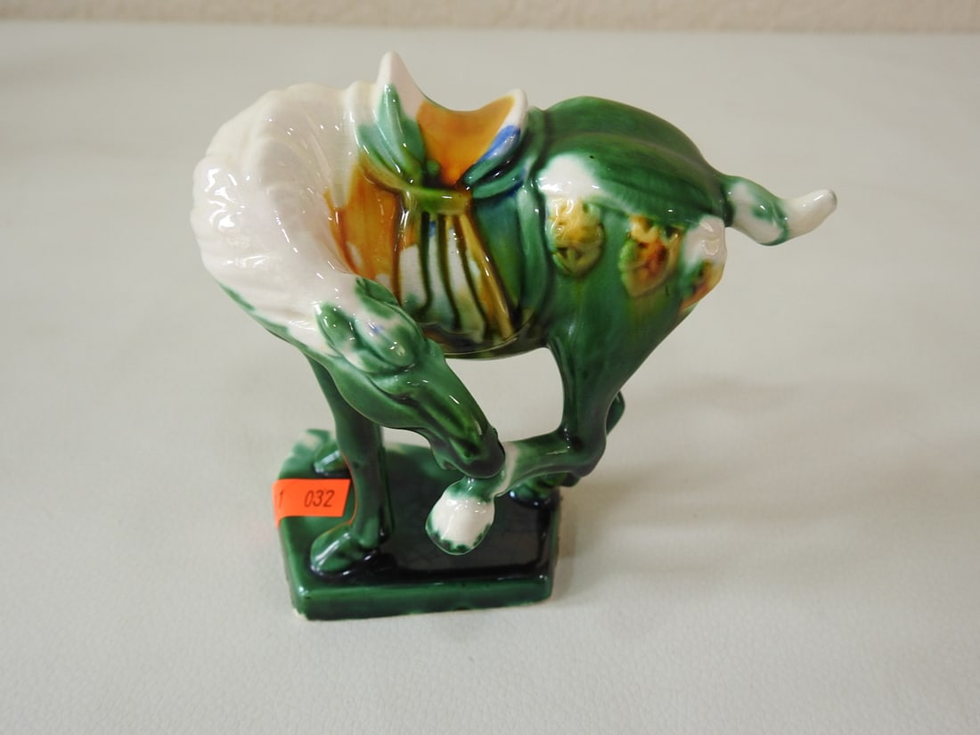 Majolica Style Green Tang Horse Figurine: Ceramic Majolica style Tang Dynasty horse figurine in green with white, yellow, blue, and green accents. Approx. 5.5 x 5.5 x 1.75 in.