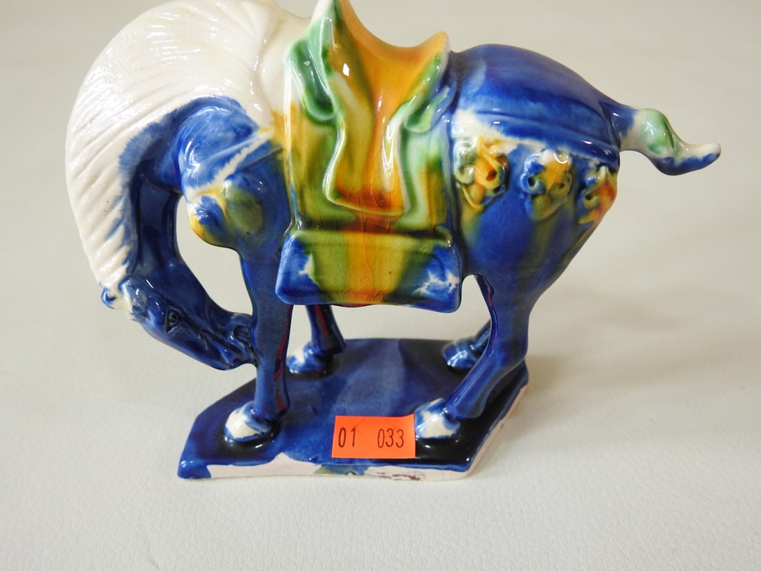 Majolica Style Blue Tang Horse Figurine: Ceramic Majolica style Tang Dynasty horse figurine in blue with white, yellow, and green accents. Approx. 4.25 x 5.25 x 5 in.