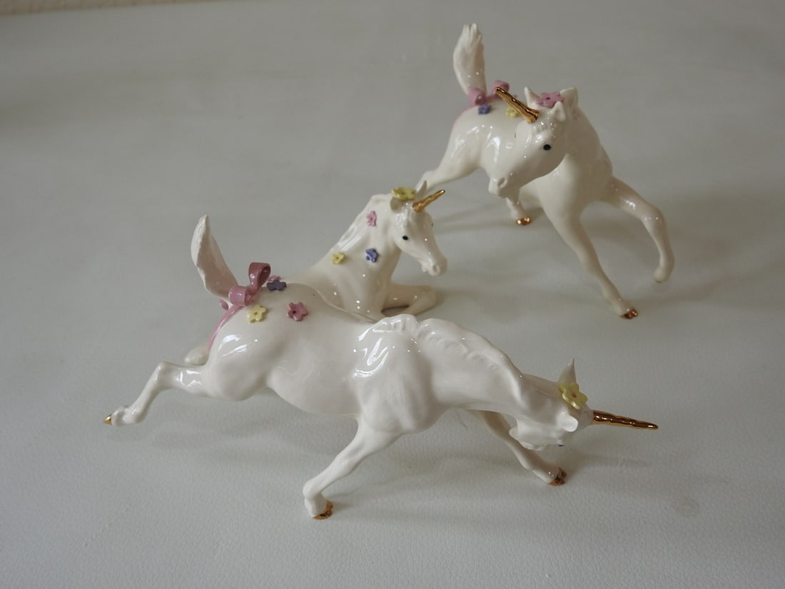 Breyer Sugar Magical Unicorn Figures Set of 3: Set of three ceramic Breyer Sugar magical unicorn model figures. Measured as a set. Approx. 12 x 6 x 6 in.