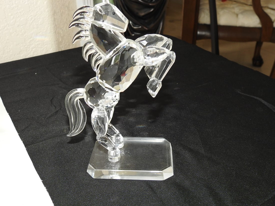 Swarovski Crystal White Stallion Figurine: Swarovski crystal White Stallion figurine, item 174958, with clear crystal horse form on rectangular base. Approx. 7.25 x 5 x 2.5 in.