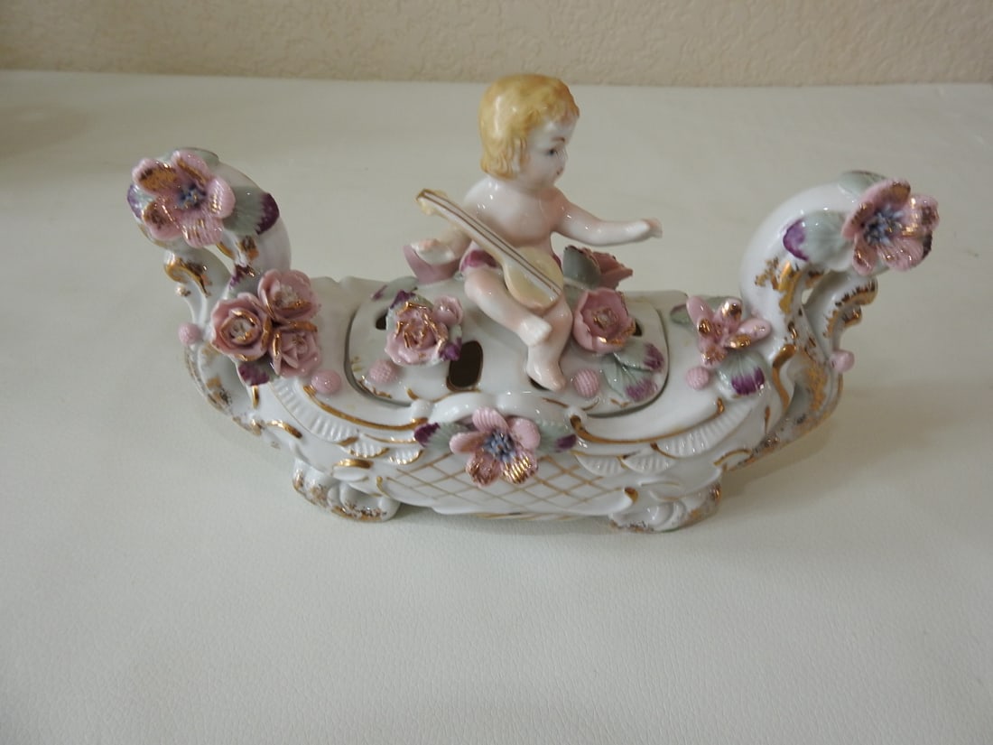 Ucagco Mid-Century Porcelain Cherub Gondola Centerpiece: Vintage Ucagco mid-century porcelain cherub gondola centerpiece / potpourri holder with floral and figural decoration. Approx. 5.25 x 8 x 3.5 in.