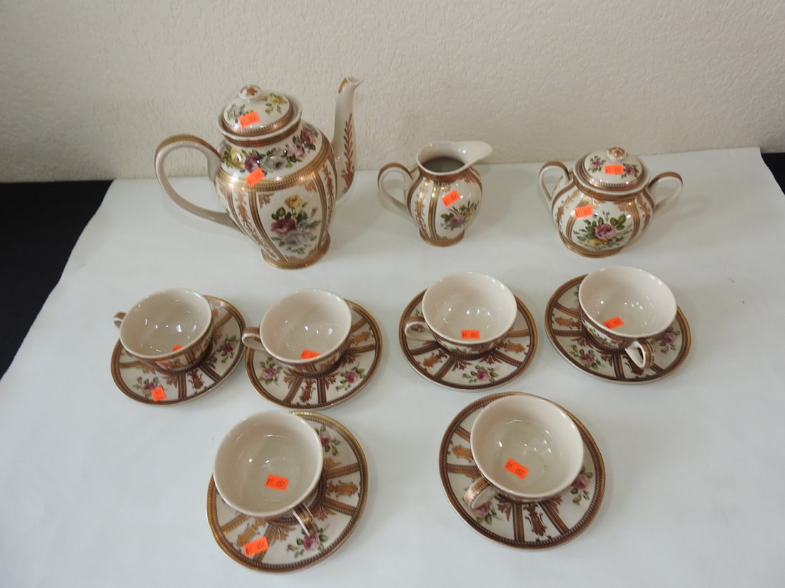 Vintage Porcelain 9-Piece Tea / Coffee Set: Vintage porcelain coffee and tea service set with gold-tone trim/plating. Nine pieces, measured as a set. Approx. 10 x 16 x 16 in.