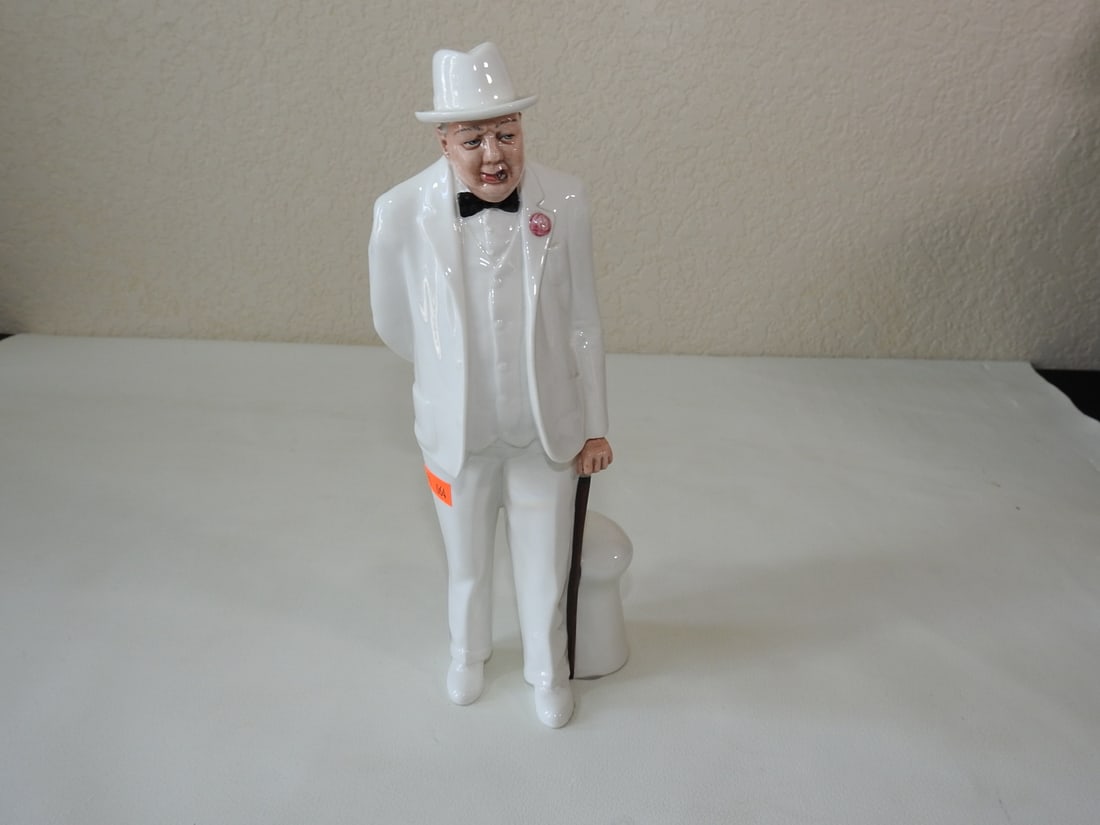 Vintage Porcelain Man in White Suit Figurine: Vintage porcelain figurine of a man in a white suit with cane. Approx. 11 x 4 x 4 in.